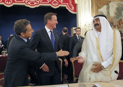 France`s president Nicolas Sarkozy and British Prime Minister with the emir of Qatar, Sheikh Hamad bin Khalifa al-Thani